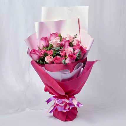 Attractive Mixed Roses Wrapped Bouquet:  Gifts Delivery