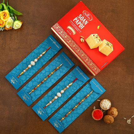 Pearl Studded And Mauli Rakhis Set Of 4 With 250 Gms Soan Papdi