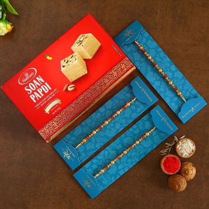 Traditional Pearl Studded Rakhis Set Of 3 With 250 Gms Soan Papdi