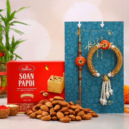 Orange Pearl Lumba Rakhi Set And Almonds With Soan Papdi